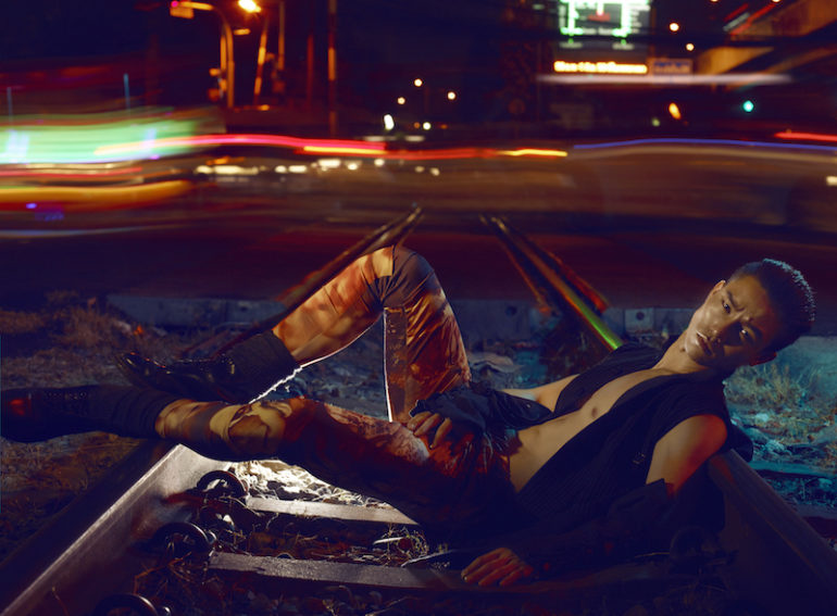 Woolen waistcoat with sleeves PIPHU THANATWASUKUL, tie-dye leggings SARUNYU CHOOSRI, socks FALKE LONDON, leather boots, DR MARTENS