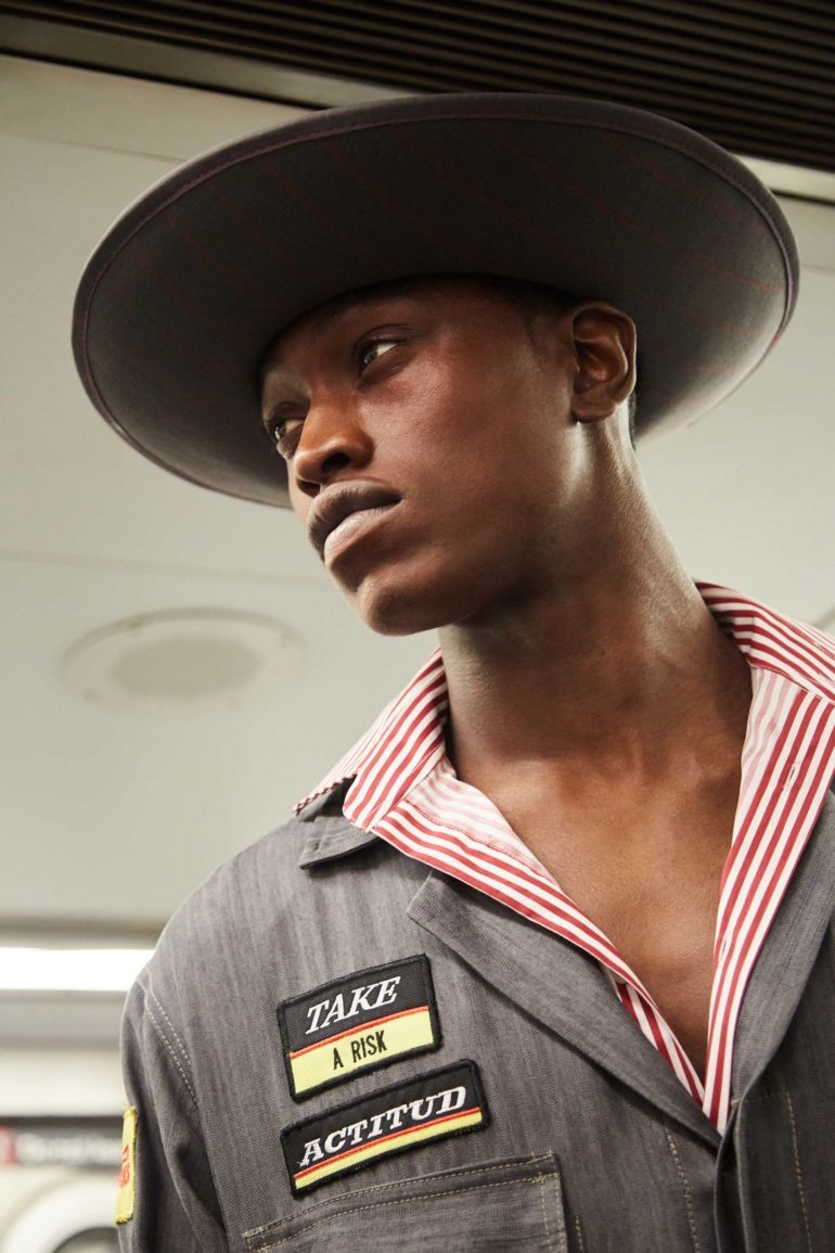 Hat, GalPon.Co; jumpsuit, Gustavo MosCoso; shoes, top owens Collection. location: NYC subway.
