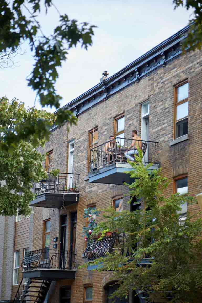 Gay couple on a balcony in Montreal, Canada