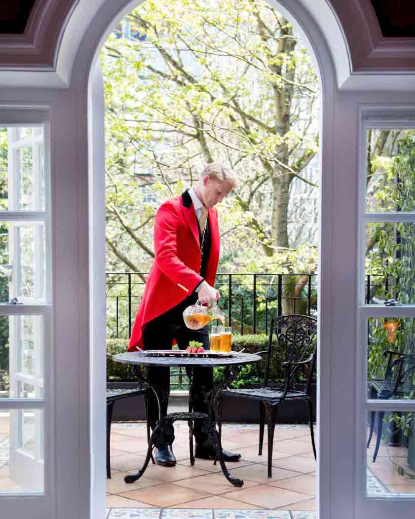 A footman serving tea at The Goring, London, United Kingdom