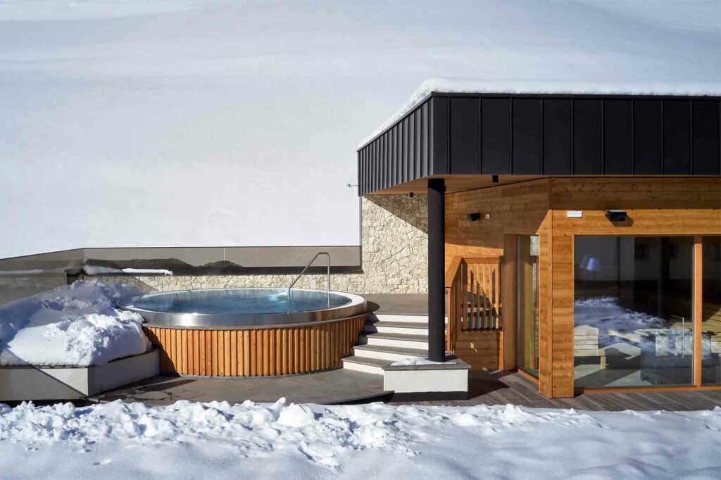 Outdoor whirlpool at Hotel Sassongher, Alta Badia, Italy