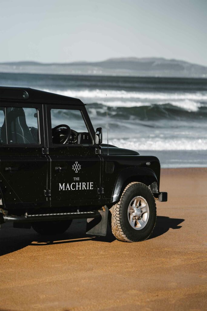 Land Rover on the beach on the Isle of Islay, Scotland