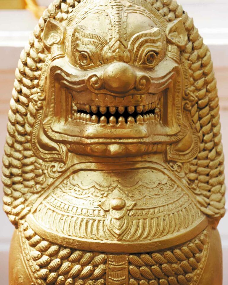 Golden statue at a temple in Bangkok, Thailand