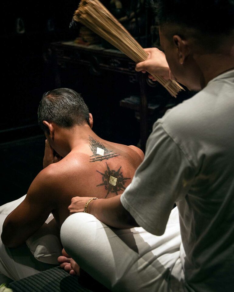 Tattooing in action at The Siam Bangkok, Thailand