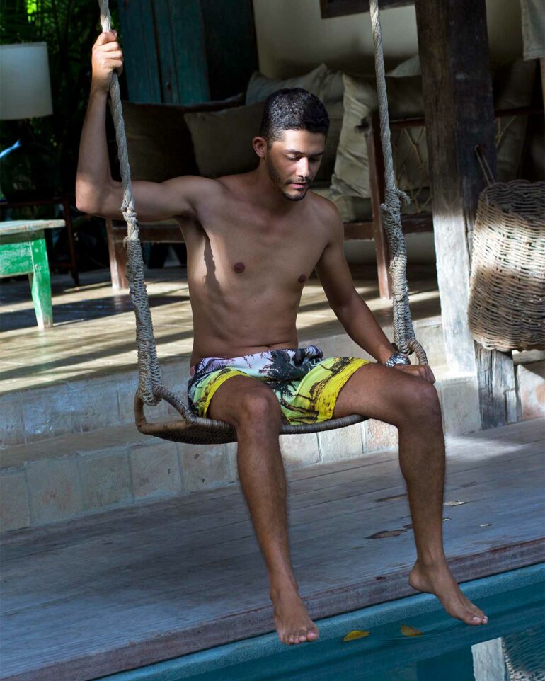 Model by the pool at Uxua Casa Hotel, Trancoso, Brazil