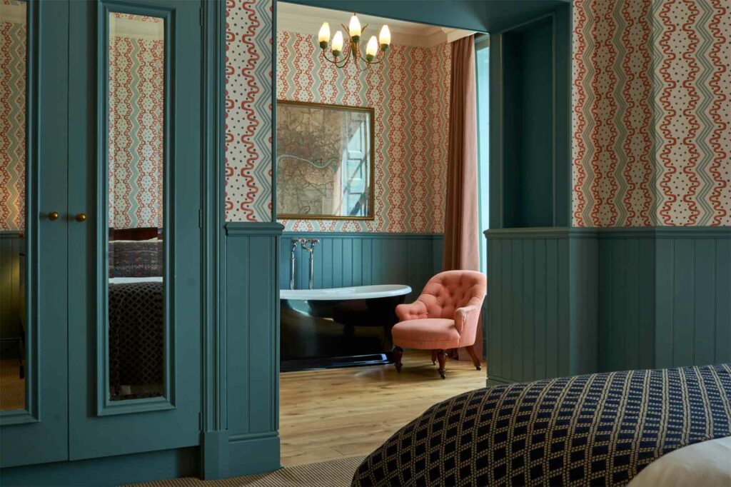 Bedroom with bathtub at The Mitre Hotel, London, United Kingdom