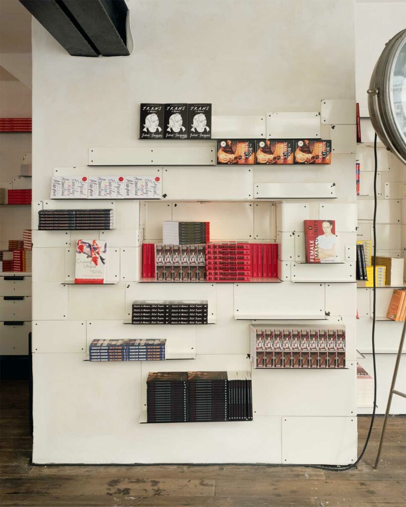 Books on a shelf at Aesop queer library, London, United Kingdom