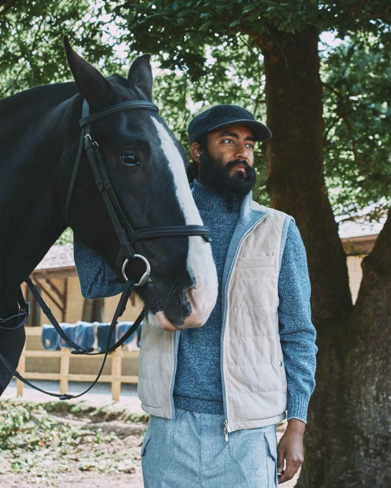 Model readies for horseback riding in Glen Artney, Scotland