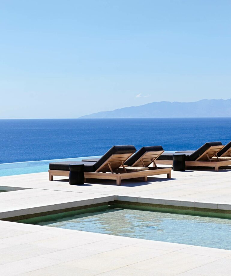 Loungers with a view at Kalesma, Mykonos, Greece