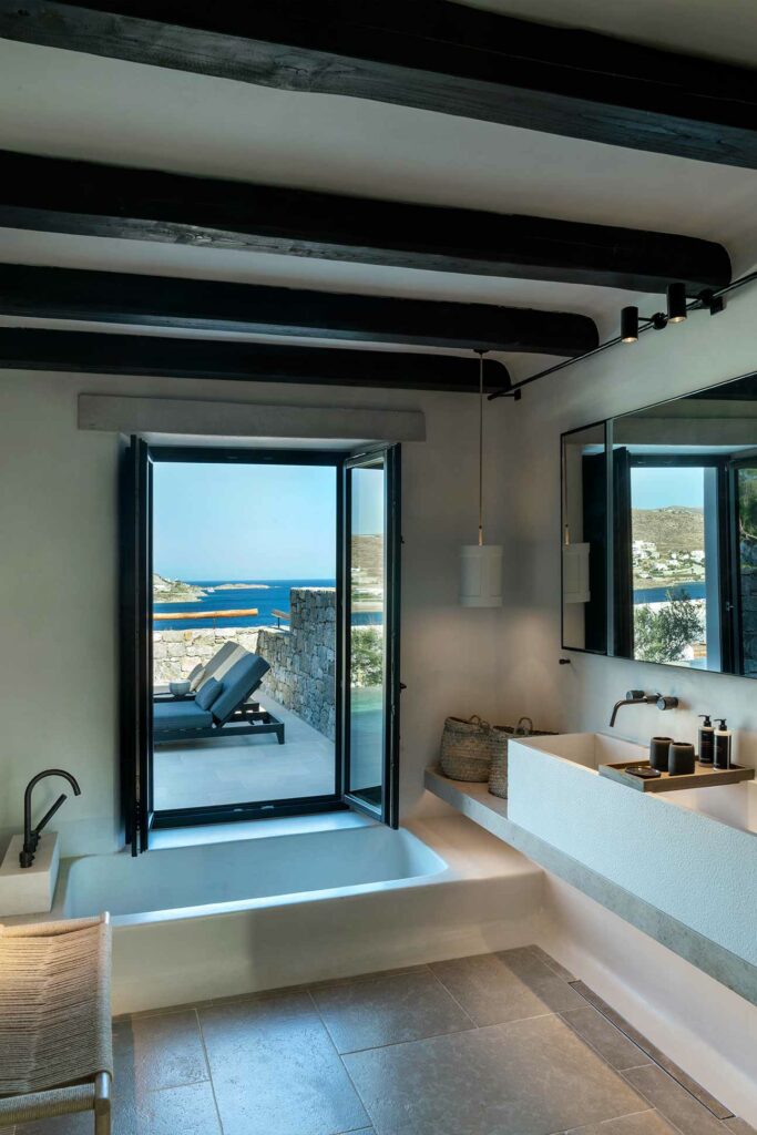 Bathtub with a view over Ornos Bay, Mykonos, Greece