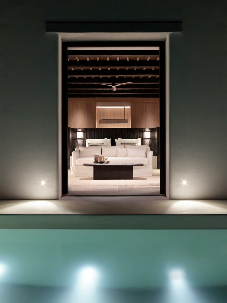 Bedroom with a view over a private pool at Kalesma, Mykonos, Greece