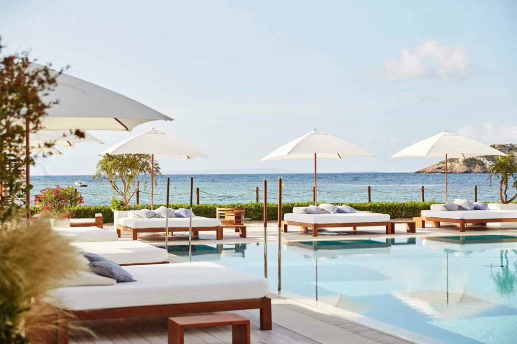 Poolside loungers on the White Isle, Spain