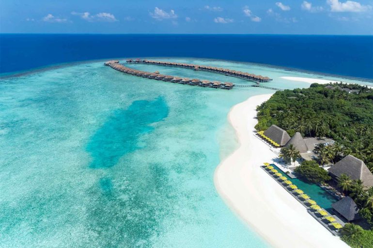 Aerial of overwater villas at Anantara Kihava Maldives Villas, The Maldives