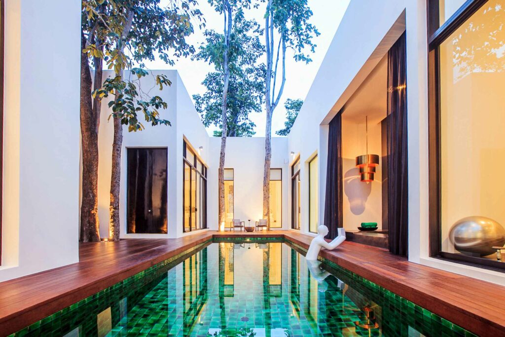 Emerald green salt-water pool and Secret pool villa at the Secret Chapter of The Library Koh Samui.