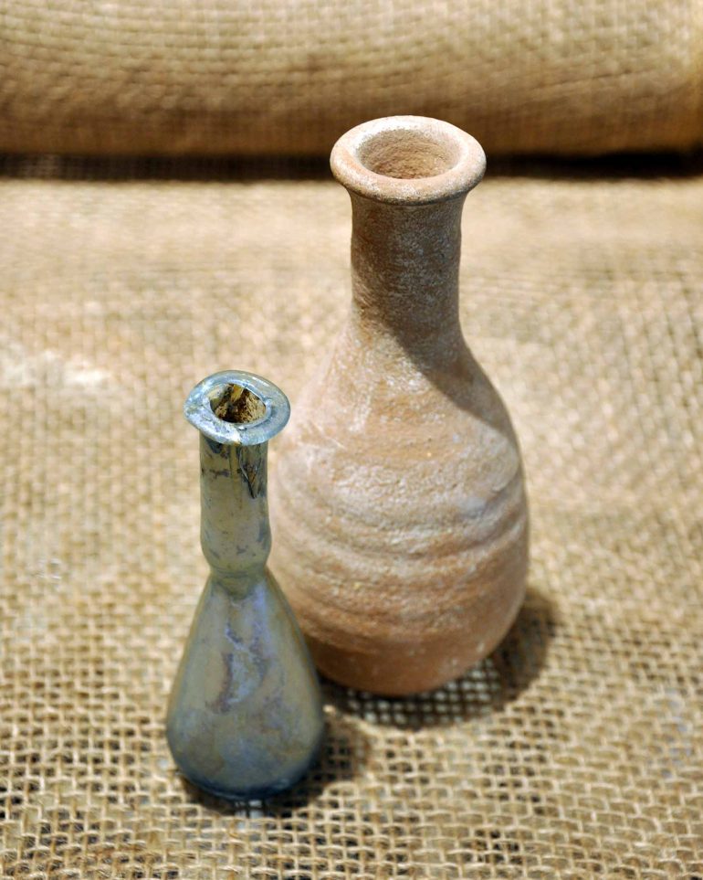 Roman tear collector bottles on sale at Zak's Antiquities, Jerusalem, Israel