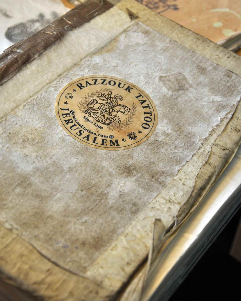 A book of motifs at Razzouk Tattoo, Jerusalem, Israel
