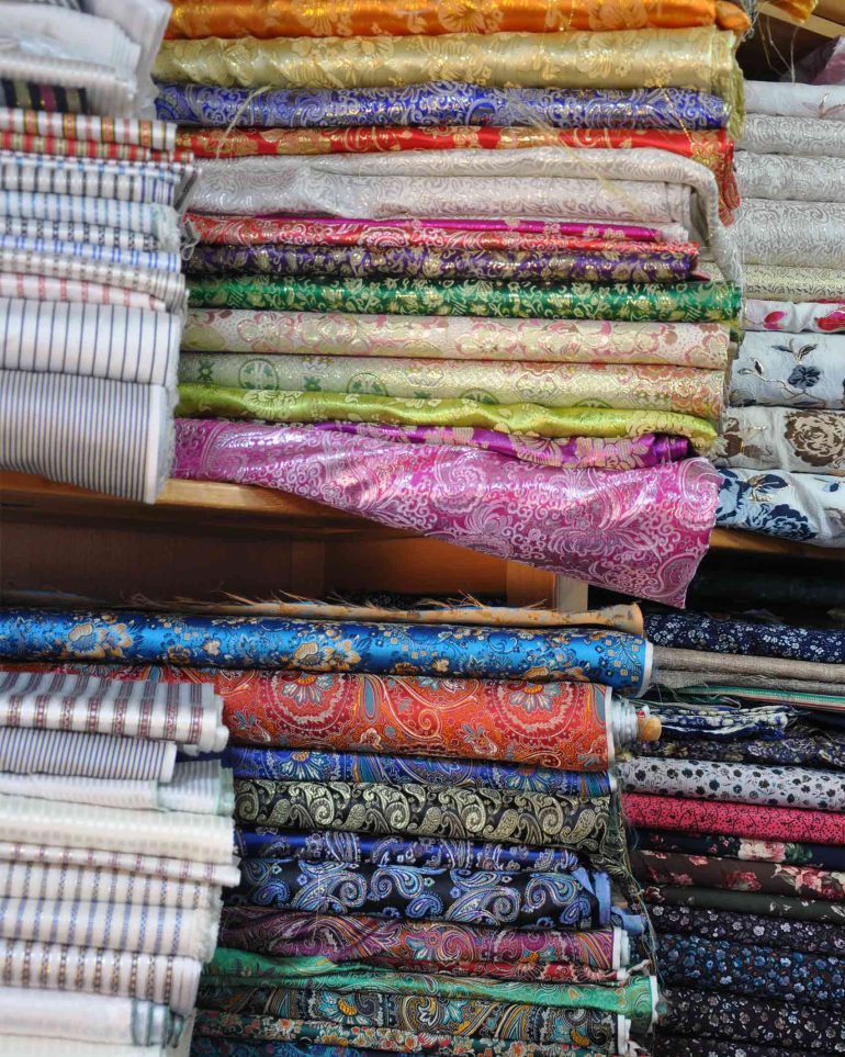 Textiles on sale at Bilal Abu Khalaf's store in Jerusalem, Israel