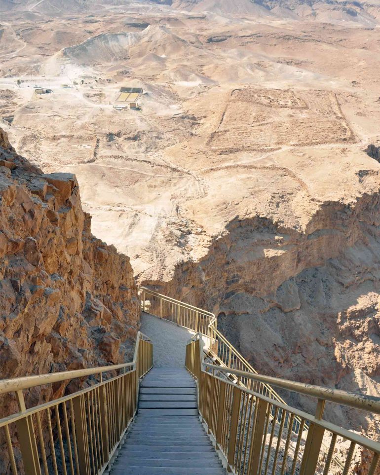 A staircase leading down to the lower tiers of Israel's Masada fortification, Judean Desert, Israel