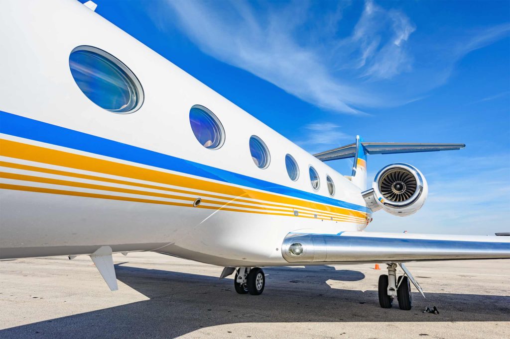 A Gulfstream G550 awaits departure at an airport