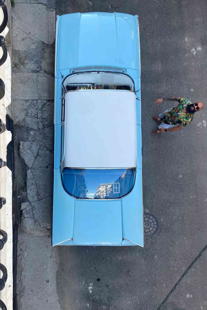 A vintage car is parked in the streets of Havana, Cuba