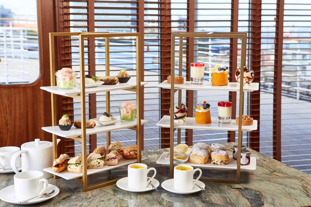Afternoon tea with a selection of colourful treats. 