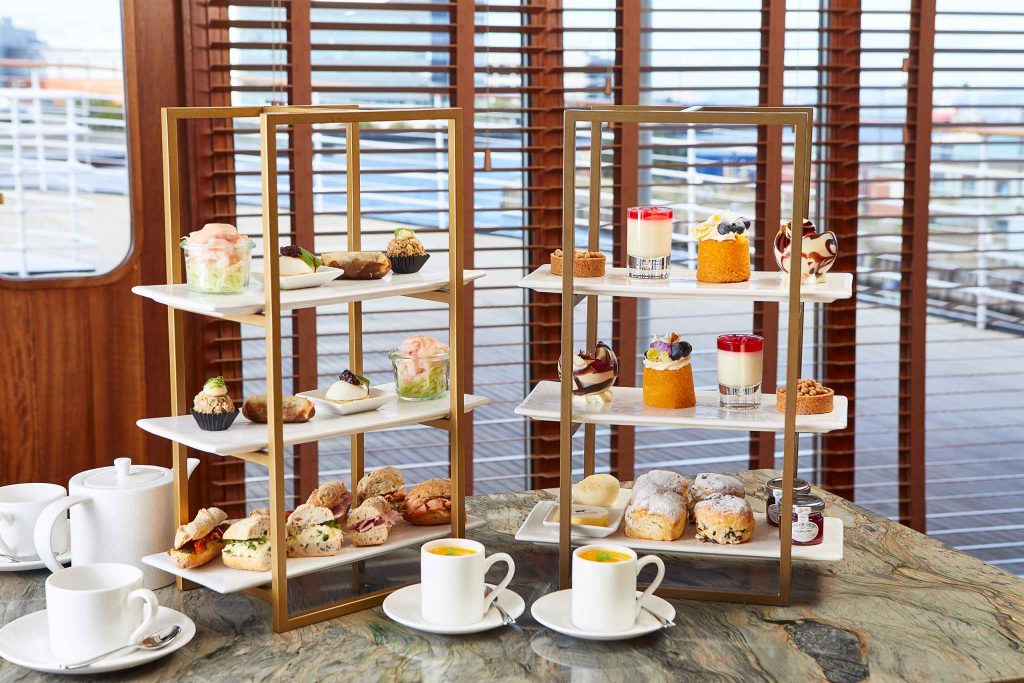 Afternoon tea with a selection of colourful treats.