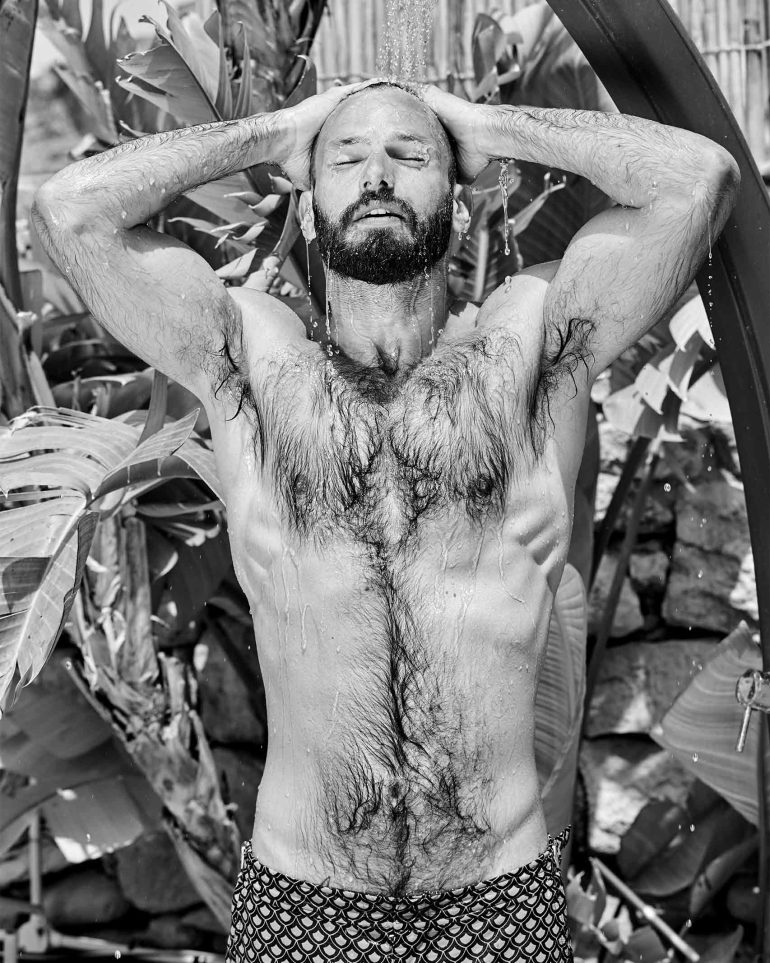 Model enjoys an outdoor shower at Thirtyseven Gozo, Malta