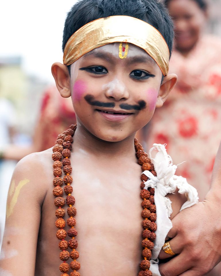 A boy wearing face paint in Kathmandu, Nepal