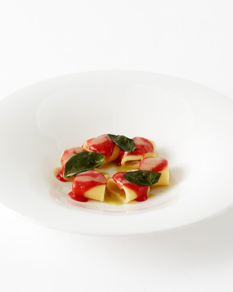 Pasta with tomato sauce and fig leaf infusion, a creation by Mauro Uliassi