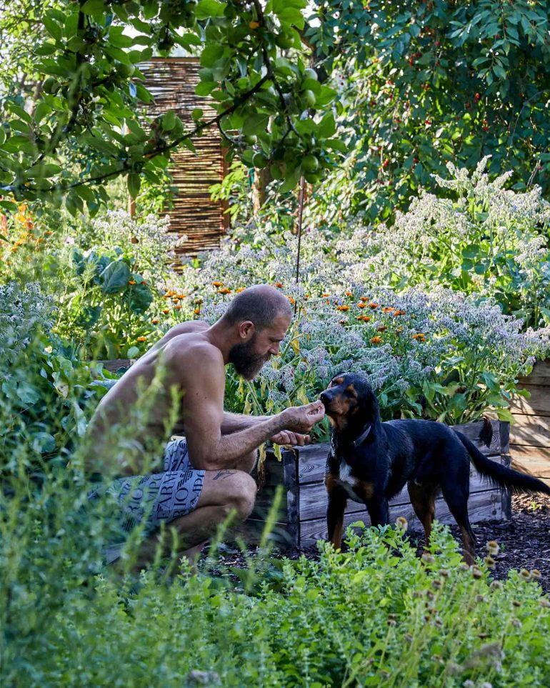 Andreas Zaremba with a dog at Hof Flieht, Uckermark, Germany