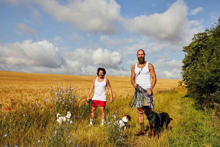 Gary Abela and Andreas Zaremba walking dogs at Hof Flieht, Uckermark, Germany