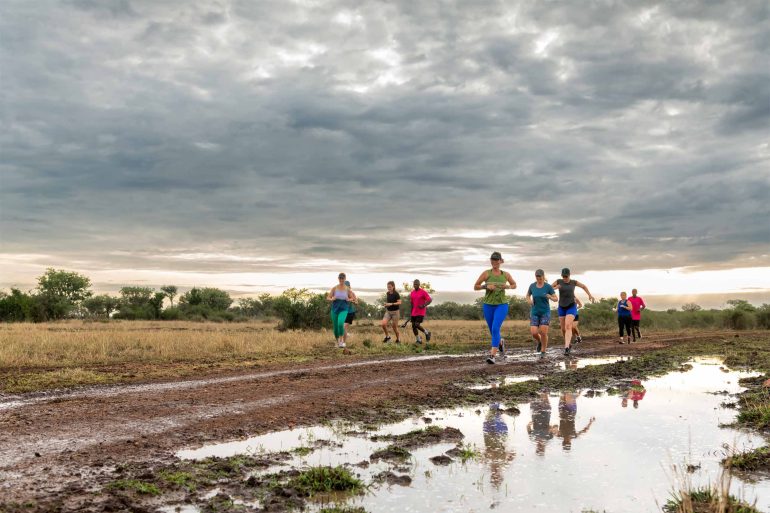 Girls Run in the Grumeti Game Reserve, Tanzania