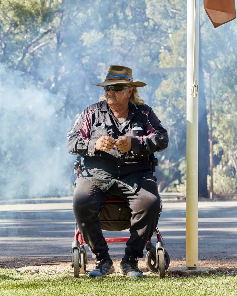A local man, one of many Aboriginal Australians, sits on a chair in South Australia, Australia
