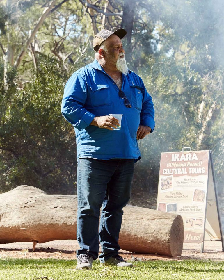 A local tour guide, one of many Aboriginal Australians, awaiting tourists for a tour of South Australia, Australia