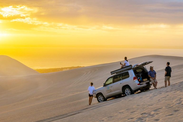 Travellers watch the sunset on the Eyre Peninsula, South Australia, Australia