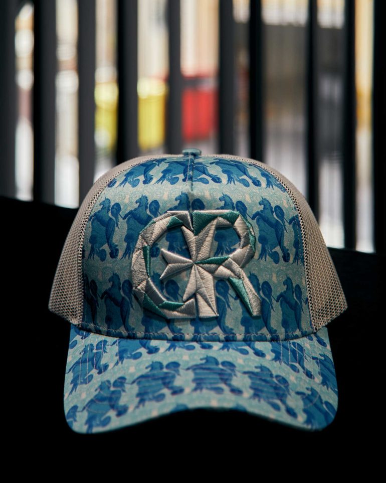 A blue boldly-designed cap at Charles and Ron's flagship store and cafe.