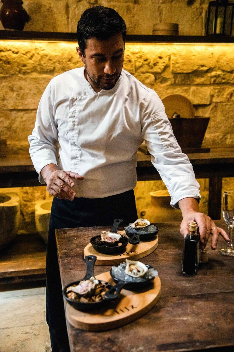 A chef prepares an oyster dish at the Ta’ Philip restaurant, Gozo, Malta