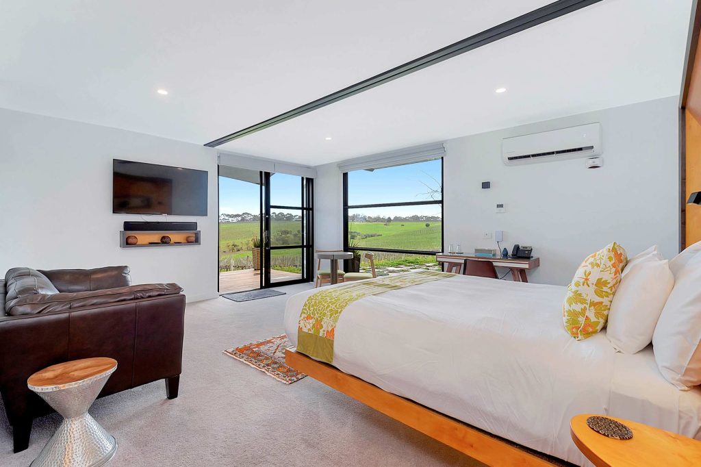 Bright bedroom suite with countryside vistas at Hotel California Road at Inkwell Wines, McLaren Vale, Australia