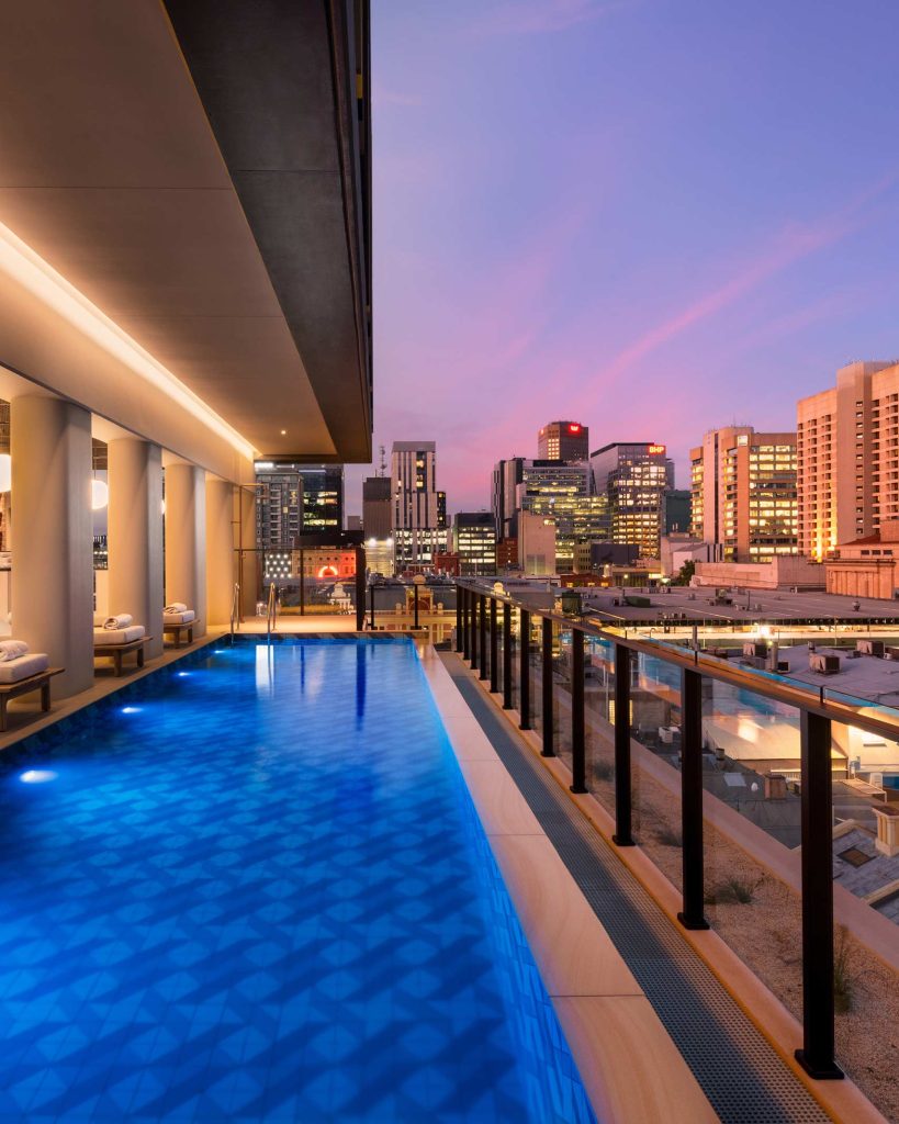 Rectangular blue pool with stunning views of Adelaide.