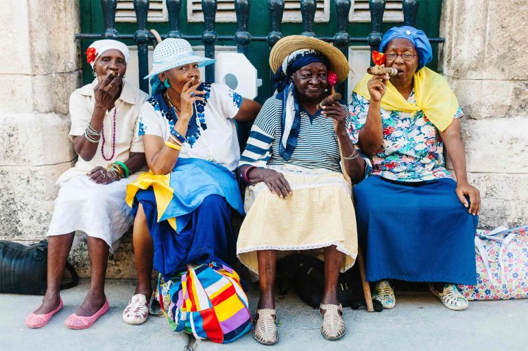 Local women enjoy cigars in Cuba