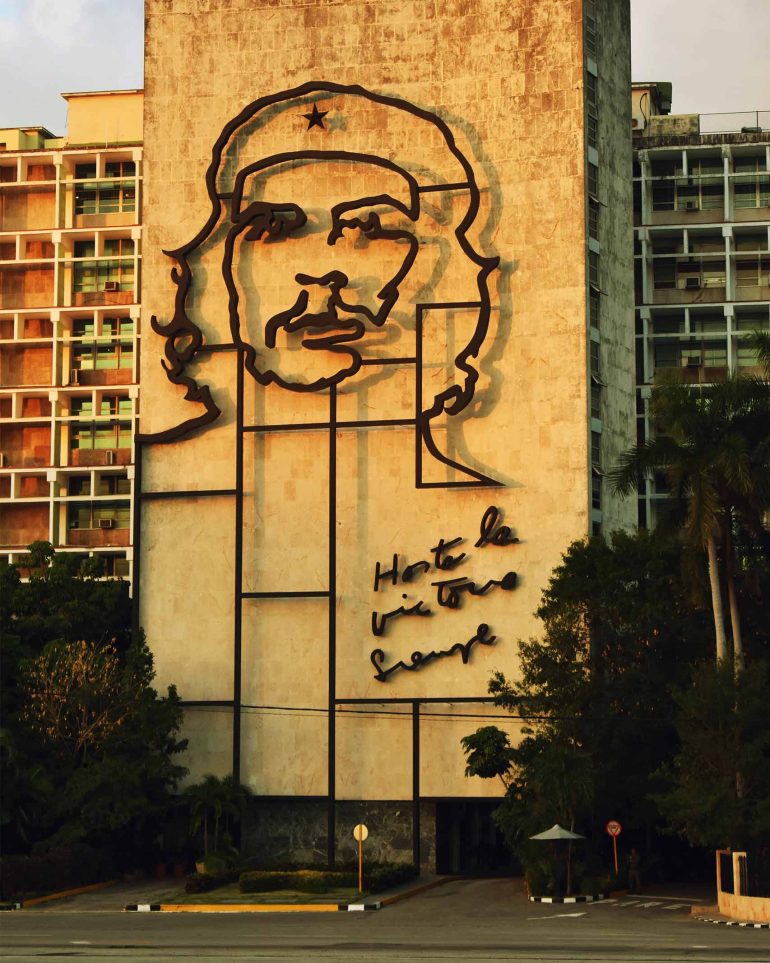 Che Guevara artwork on a building facade in Cuba
