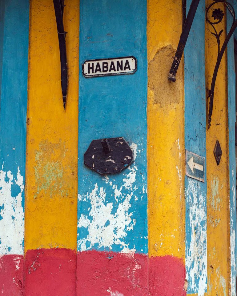 A street sign on colourful walls in Havana, Cuba