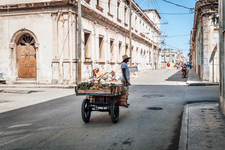 A local man sells produce in the streets of Havana, Cuba
