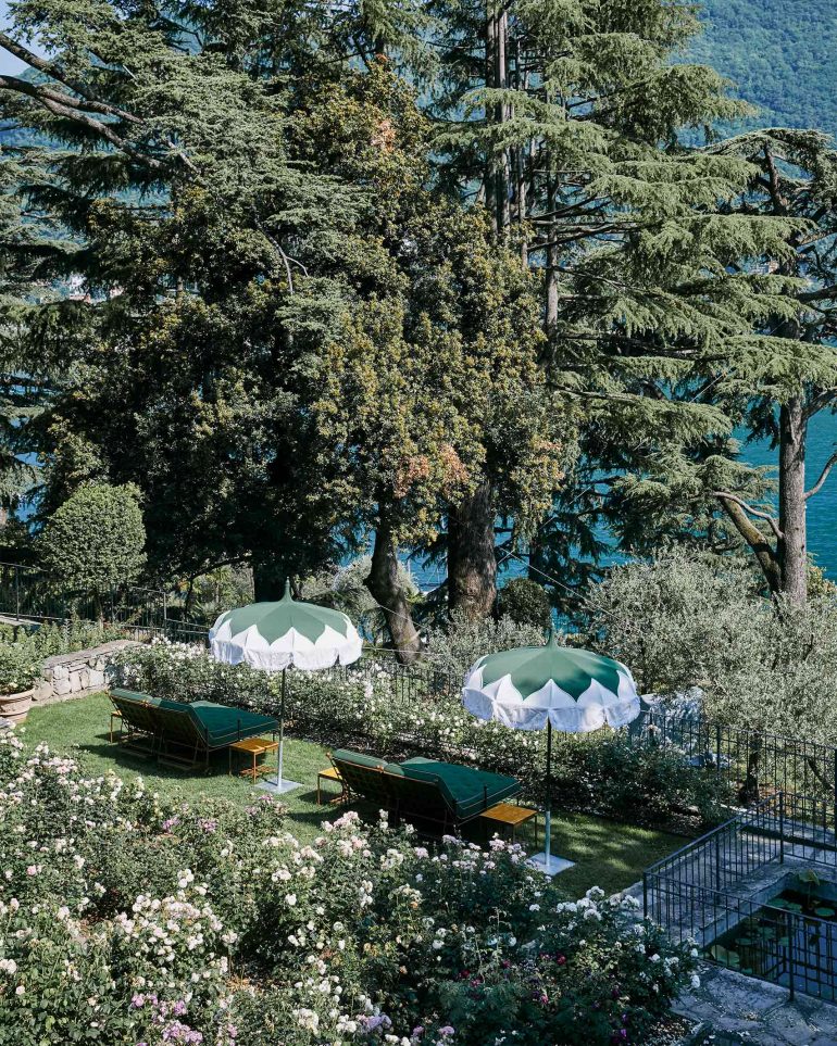 Parasols by the water at Passalacqua, Lake Como, Italy