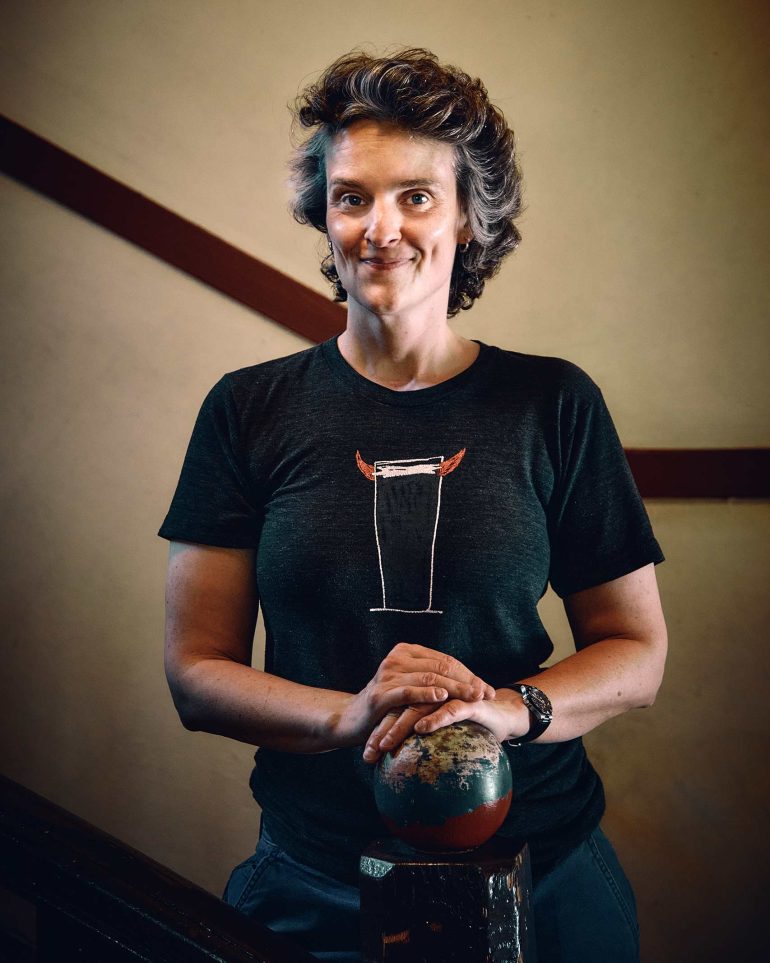 Jade Flavell stands by a staircase inside The Wheatsheaf Hotel, Adelaide, Australia