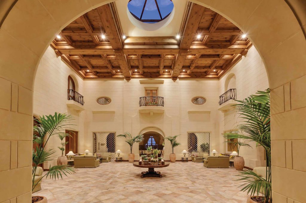 The Mediterranean-style resort foyer with honey-coloured limestone walls