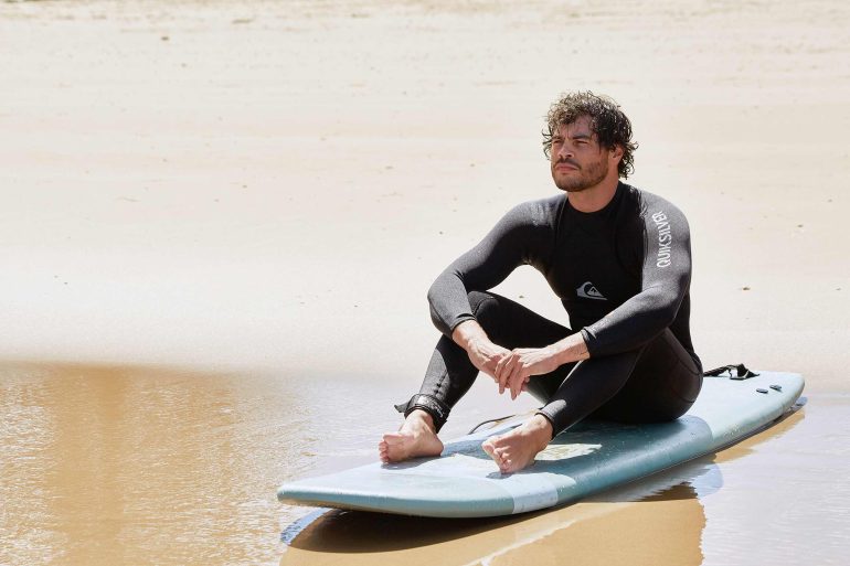 Model Nathan McGuire sits on the beach in South Australia, South Australia menswear editorial, Australia