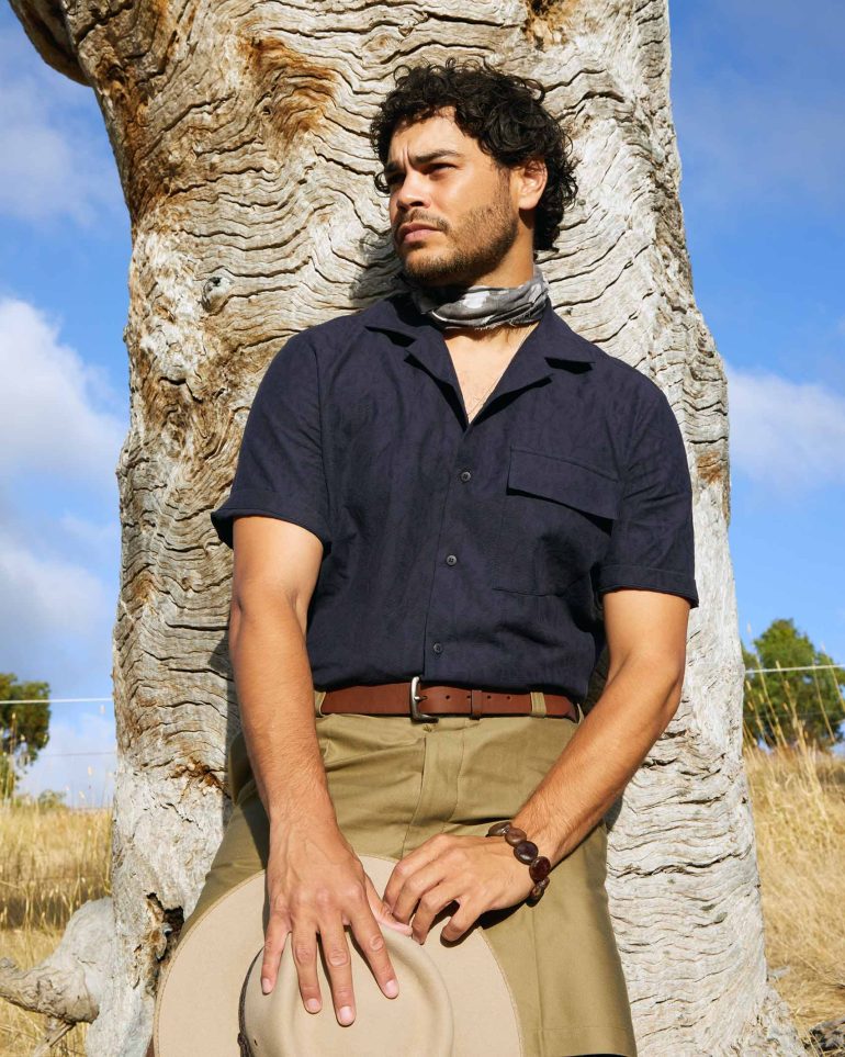 Model Nathan McGuire leaning against a tree, South Australia menswear editorial, Australia