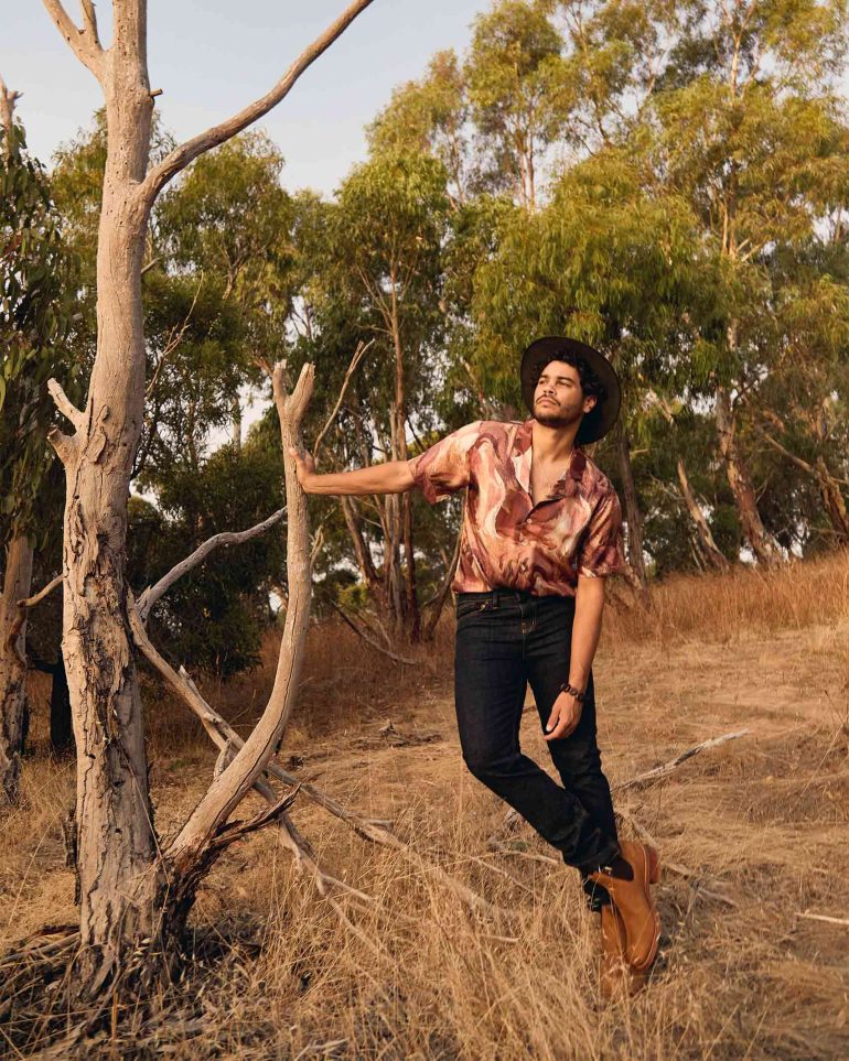 Model Nathan McGuire poses with a tree, South Australia menswear editorial, Australia