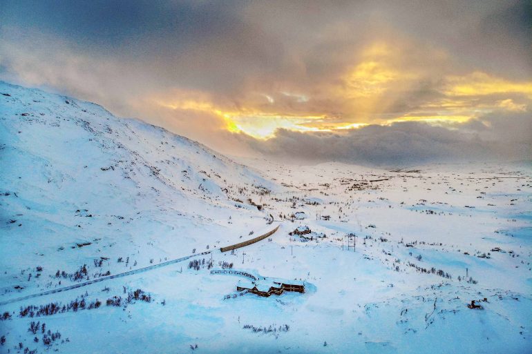 The sun rises over Niehku Mountain Villa, Riksgränsen, Sweden